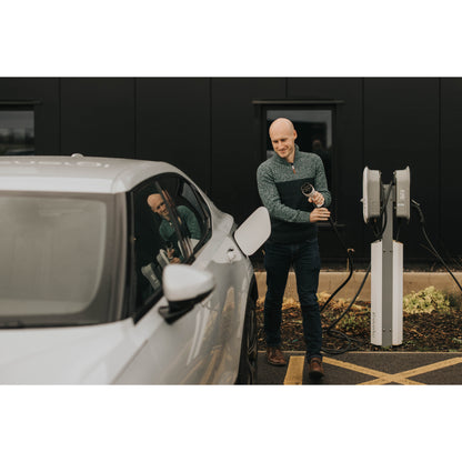 zappi Tethered EV Charger in White - man charging