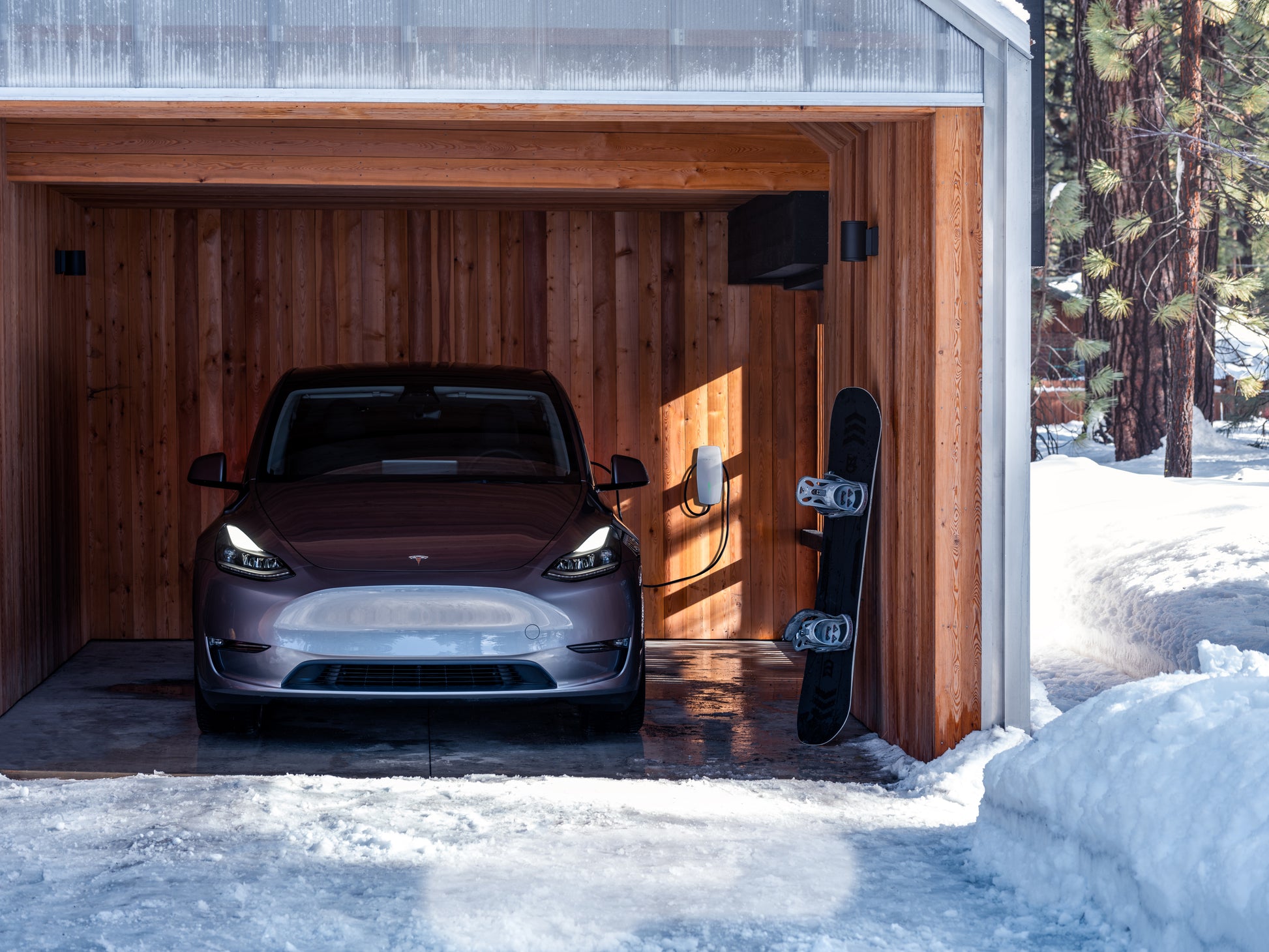 Tesla Wall Connector Generation 3 Tethered EV Chargepoint 1529455-02-E - front on shot of car charging in garage