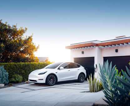 Tesla Wall Connector Generation 3 Tethered EV Chargepoint 1529455-02-E - angled shot of car charging in driveway