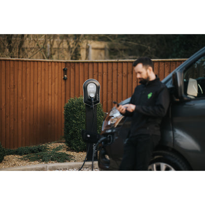 zappi Tethered EV Charger in Black - man using app close up