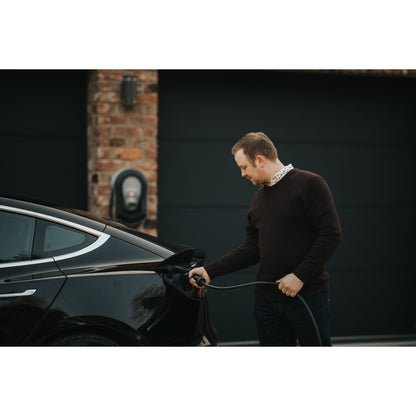 zappi Tethered EV Charger in Black - man charging